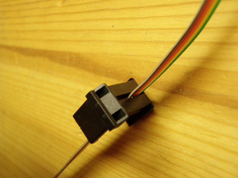 File:Pass the cable in the strain relief.JPG